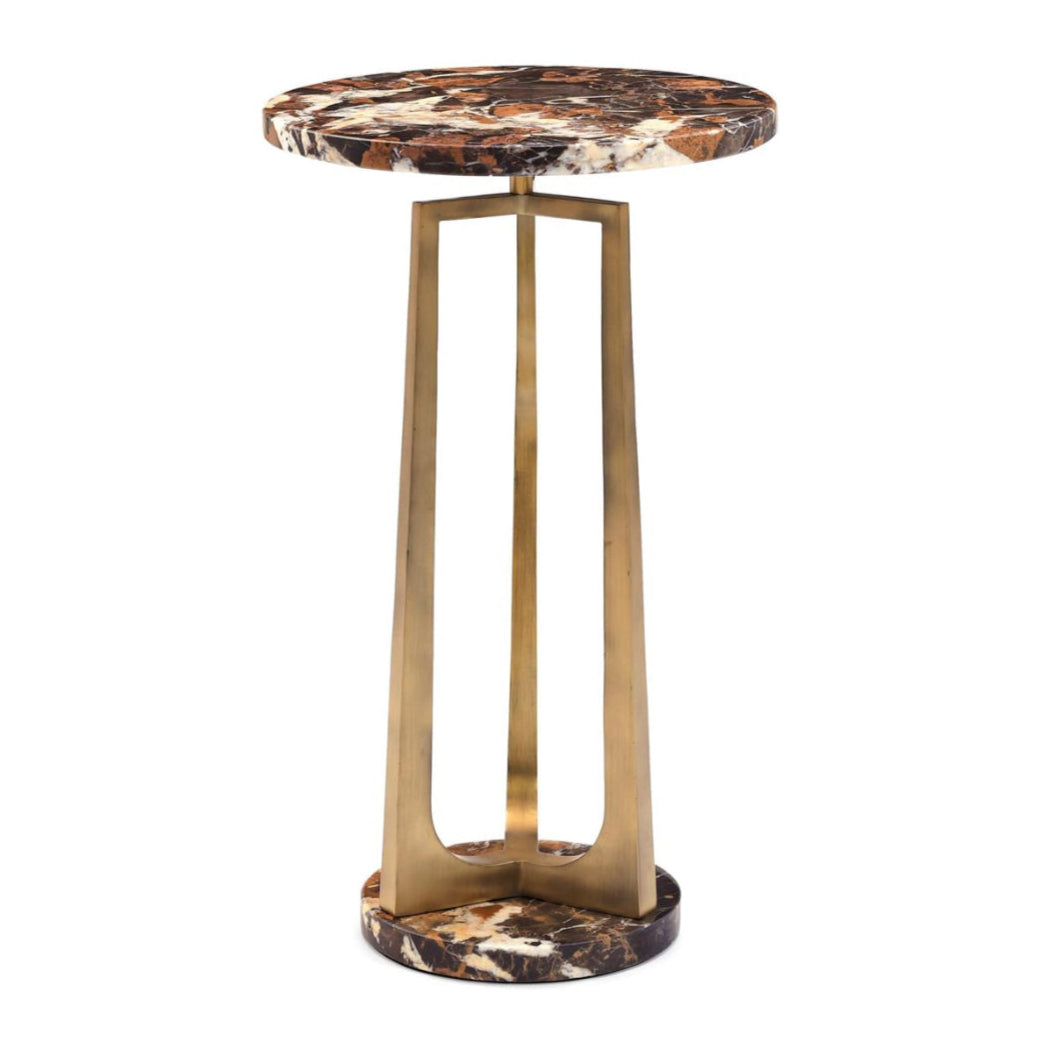 Decorative table with marble top and brass base on a white background